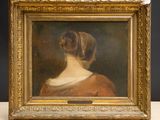 portrait of a woman in a red dress by a gold frame