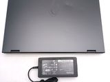 a laptop that has a charger attached to it