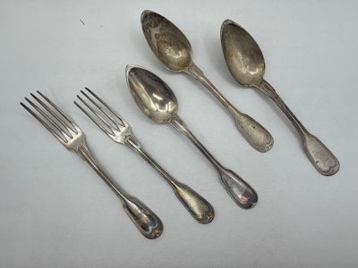 five silver spoons and two forks are lined up on a white surface