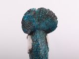 a statue of a woman in a blue dress with a large hat on her head