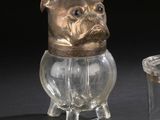 a glass jar with a dog on it next to a glass jar with a dog on it