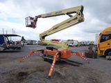 a crane that is sitting in the middle of a parking lot
