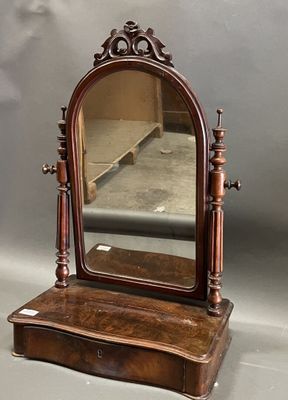 an antique wooden dressing table with a mirror on top of it