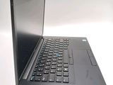 a black laptop with a black keyboard on a white surface
