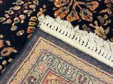 an image of a close up of a rug on a wooden floor