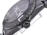 a close up of a watch on a white surface
