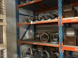 many shelves with various items on them in a room