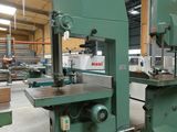 two machines that are sitting on pallets in a warehouse