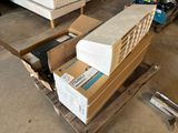 a pile of boxes sitting on a pallet in a room