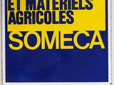 an image of a blue and yellow sign on a white wall