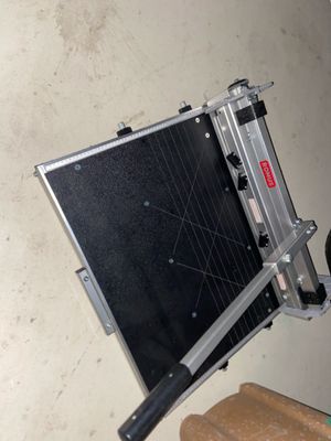a black and silver case sitting on top of a table