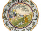 une assiette avec l'image d'un homme et d'un chien