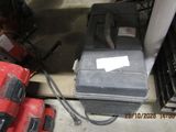 a picture of a tool box sitting on the floor next to other tools