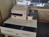 a small desk with a printer and a phone on it