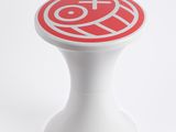 a white stool with a red and white logo on it