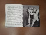 an open book with a picture of marilyn monroe on it