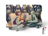 a group of figurines of people sitting on a bench