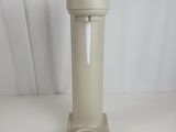 a white water dispenser on a white table