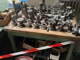 a table with a bunch of metal objects on it