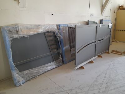 two refrigerators in the middle of a room that is being remodeled