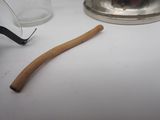 a toothbrush sitting on a table next to a glass