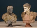 two busts of a man and a woman sitting on a table