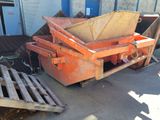 a dumpster that is sitting on the ground next to a pallet