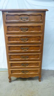 a wooden chest of drawers with five drawers on each side