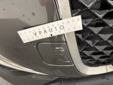 a close up of a car ' s front grill with a ruler on it