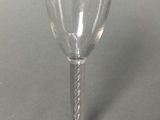 a wine glass that is sitting on a table