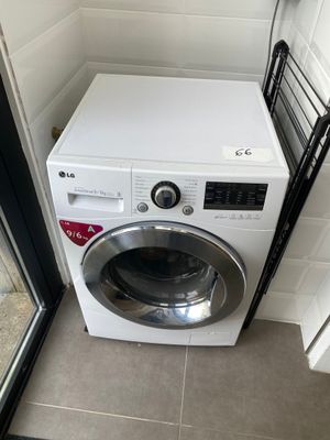 a washer and dryer in a small room