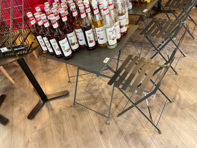 many bottles of alcohol sitting on a table in a store