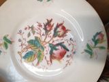 a plate with a floral design on it on a table