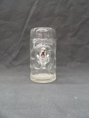 a glass mug with a picture of a man on it