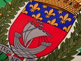a close up of a tie with a coat of arms on it