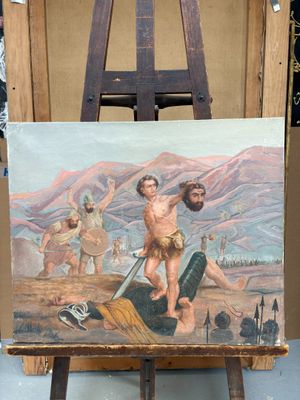 un tableau représentant un homme tenant une épée, posé sur un chevalet