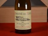a bottle of wine that is sitting on a table