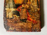 an old painting of a rooster on a wooden block on a table