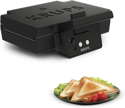 une image représentant un grille-pain sur lequel se trouve un sandwich