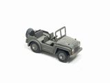 a toy army jeep with a flat bed on a white surface