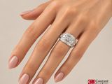 an image of a woman ' s hand with a diamond ring on it