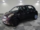 a picture of a small car parked in a garage