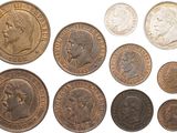 a group of old coins on a white background