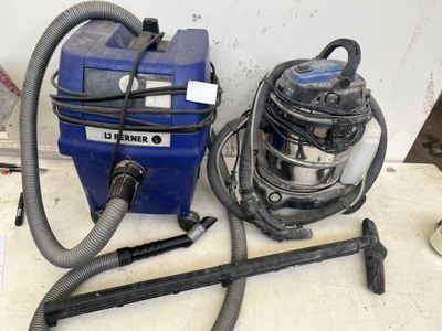 a blue vacuum and a blue canister sitting on a table
