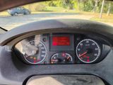 a car dashboard with a speedometer and gauges on it