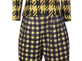 an image of a mannequin wearing a yellow and black checkered shirt and pants