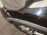 a close up of a car ' s front bumper and fender