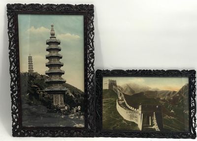two framed pictures of asian architecture on the wall