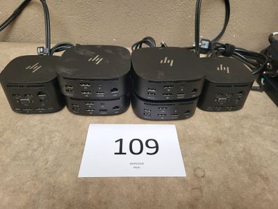a lot of computers that are sitting on a table