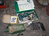a box of tools sitting on the floor next to a box of wires